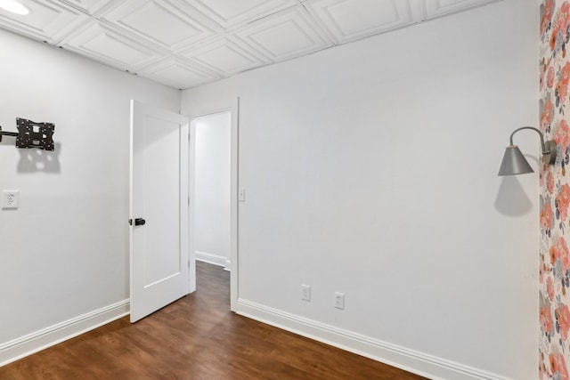 empty room featuring dark wood-type flooring