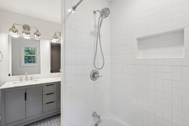 bathroom featuring vanity and tiled shower / bath combo