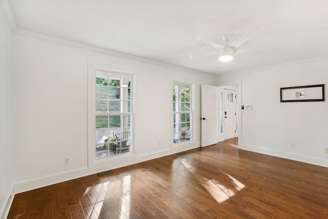 spare room featuring ceiling fan, dark hardwood / wood-style flooring, and ornamental molding