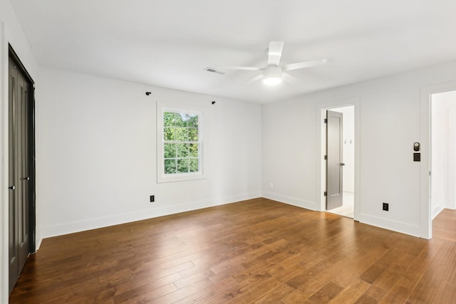 unfurnished room with ceiling fan and wood-type flooring