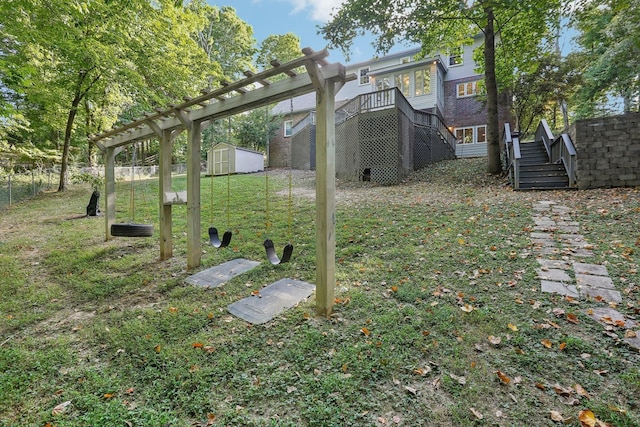 view of yard featuring a storage unit and a deck