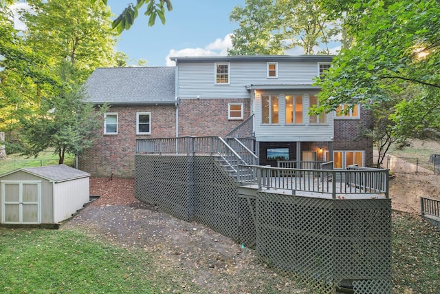 back of house featuring a shed and a deck