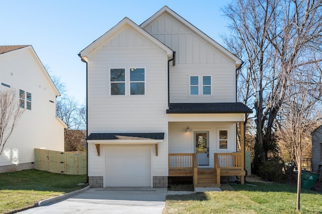 view of front of house featuring a front yard and a garage