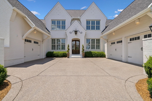 view of front of property featuring french doors and a garage