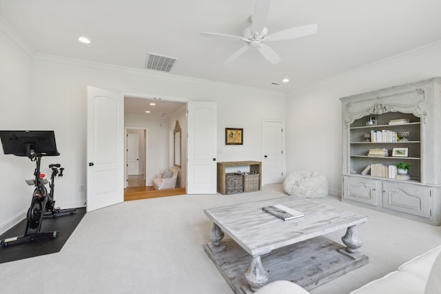 carpeted living room featuring ceiling fan and crown molding