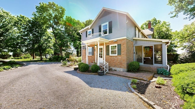 view of front of property with a balcony