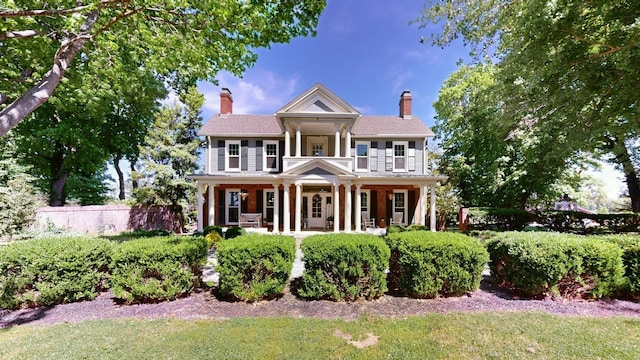 greek revival house with covered porch