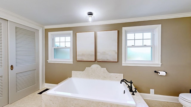 bathroom featuring tiled tub, plenty of natural light, and ornamental molding