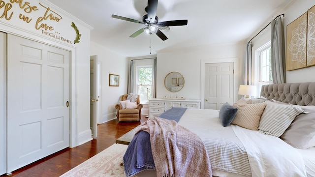 bedroom with ceiling fan, dark hardwood / wood-style flooring, and ornamental molding