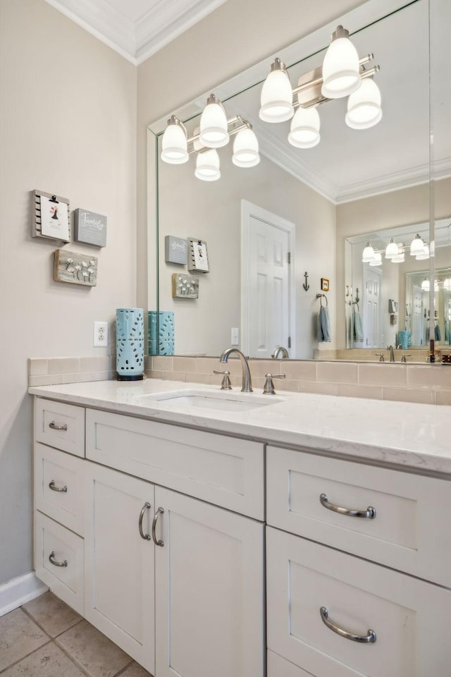 bathroom with tile patterned floors, vanity, and ornamental molding