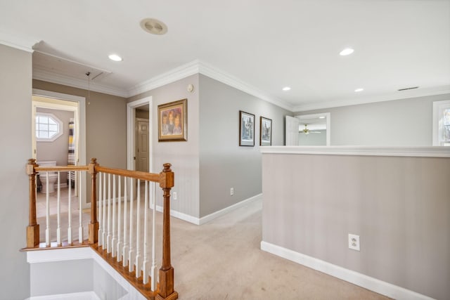 corridor with light carpet and crown molding