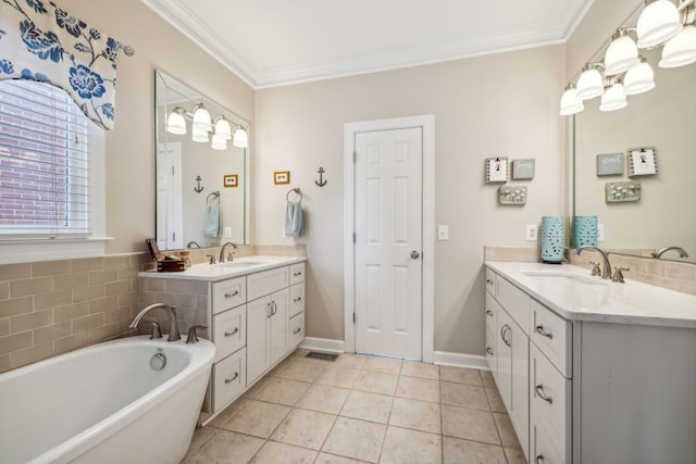 bathroom with a bathtub, tile patterned flooring, vanity, and ornamental molding