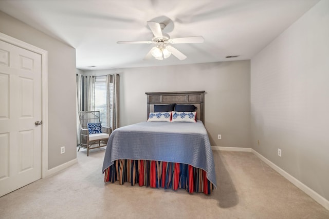 bedroom with ceiling fan and light colored carpet