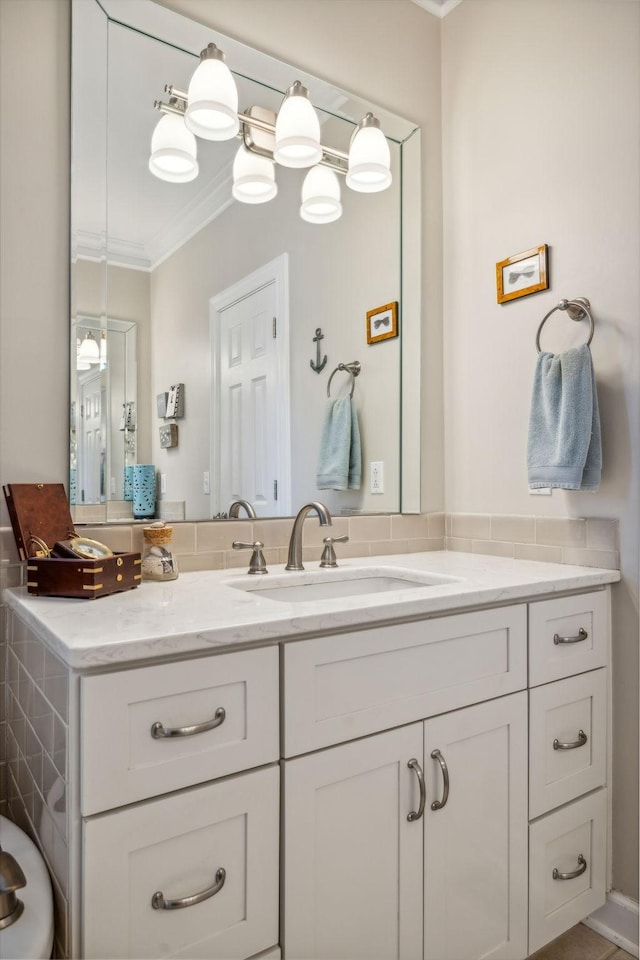 bathroom featuring vanity and ornamental molding