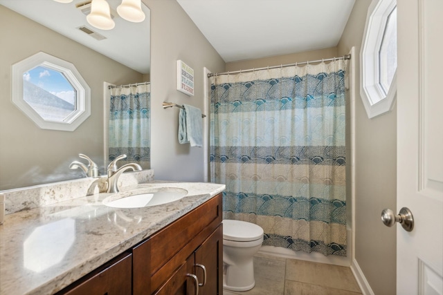 bathroom featuring tile patterned flooring, a shower with curtain, vanity, and toilet