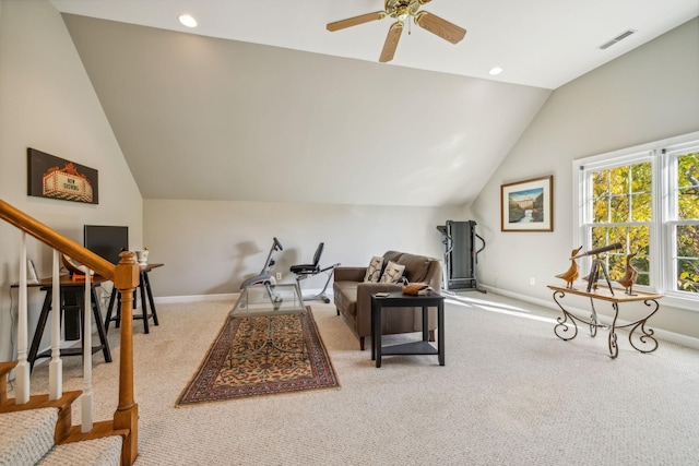 living area featuring ceiling fan, lofted ceiling, and light carpet