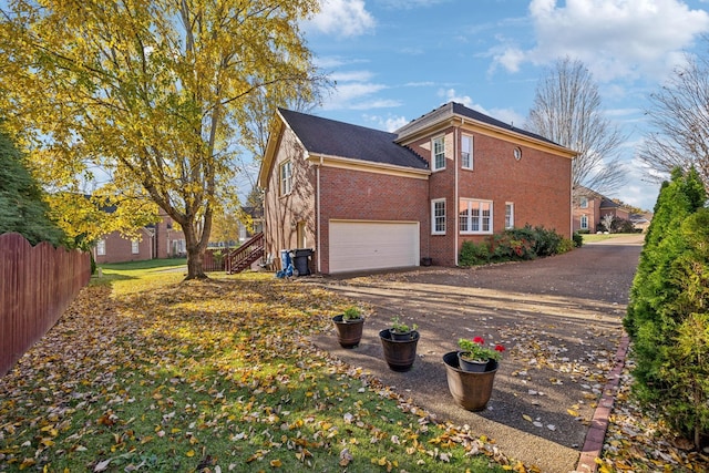 view of property exterior featuring a garage