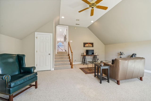 living area with ceiling fan, lofted ceiling, and light carpet