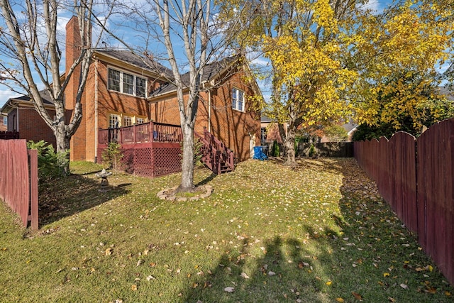 view of yard with a wooden deck