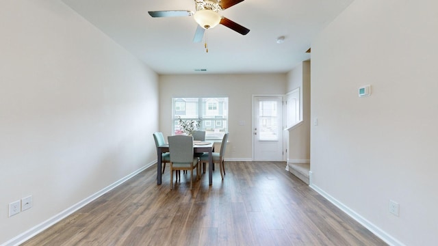 unfurnished dining area featuring ceiling fan and hardwood / wood-style floors