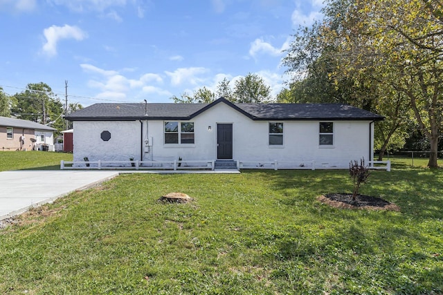 ranch-style house with a front yard