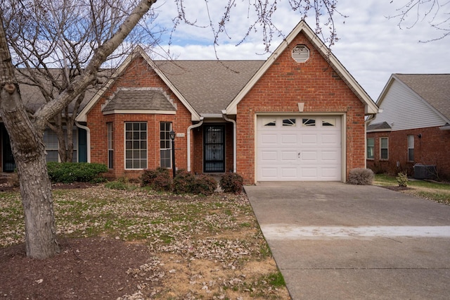 single story home with a garage and central air condition unit