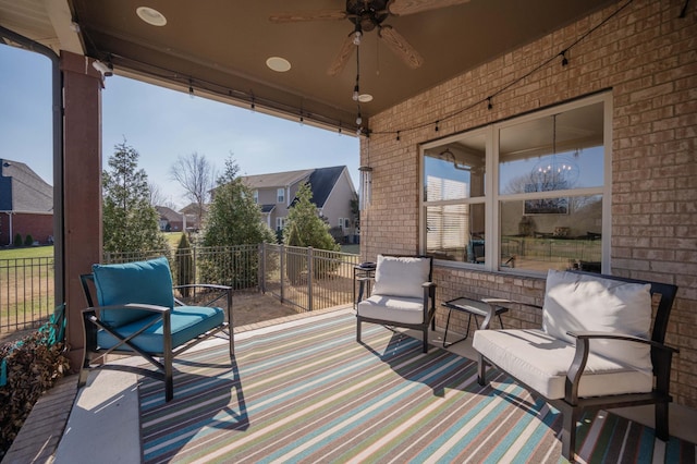 view of patio / terrace featuring ceiling fan and a balcony