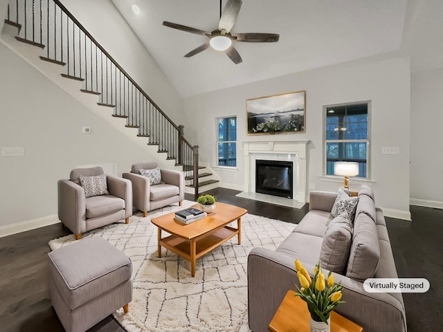 living room with hardwood / wood-style floors and ceiling fan