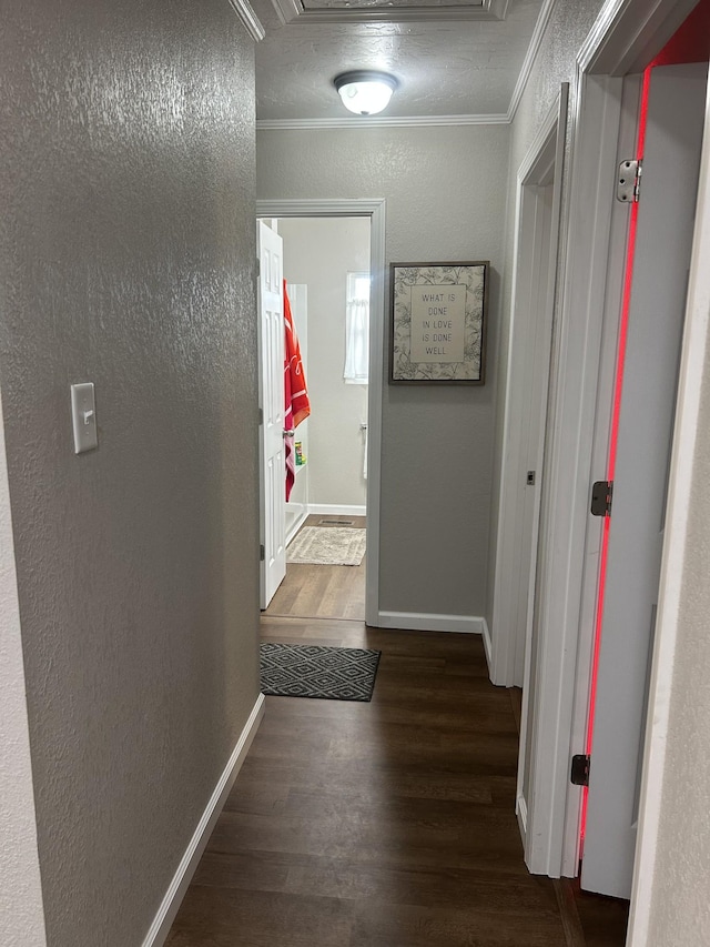 hall featuring crown molding and dark wood-type flooring