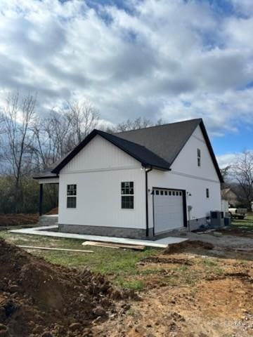 view of side of property with a garage