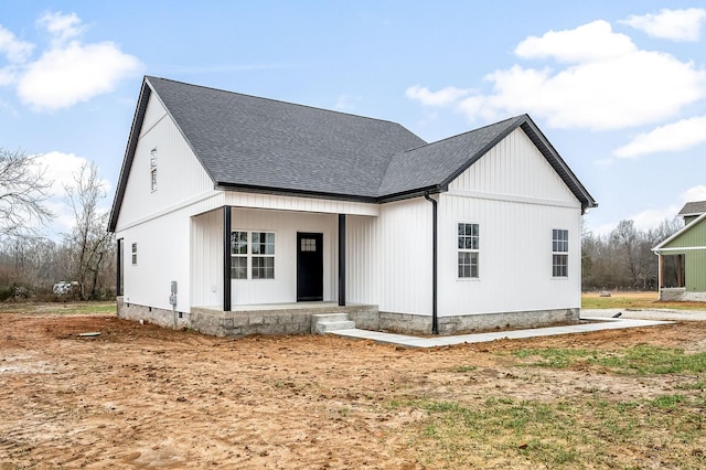 modern inspired farmhouse featuring covered porch