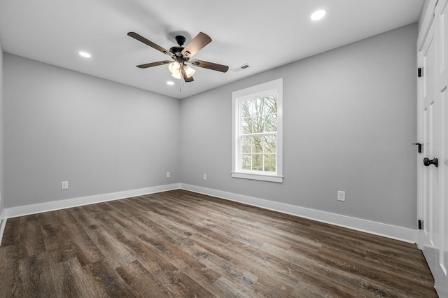 empty room featuring dark hardwood / wood-style floors and ceiling fan