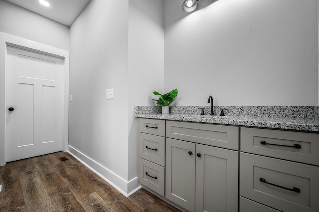 bathroom with vanity and wood-type flooring