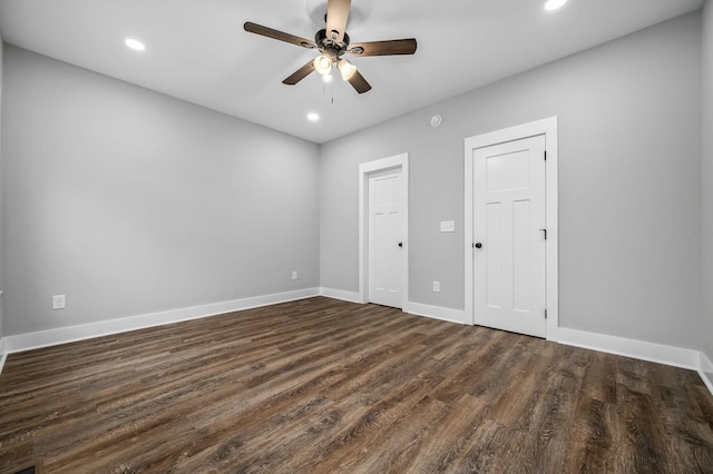 unfurnished bedroom with dark wood-type flooring and ceiling fan