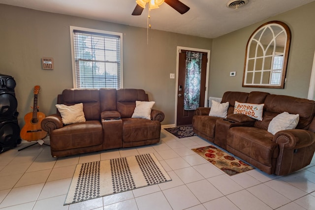 living room featuring ceiling fan and light tile patterned flooring