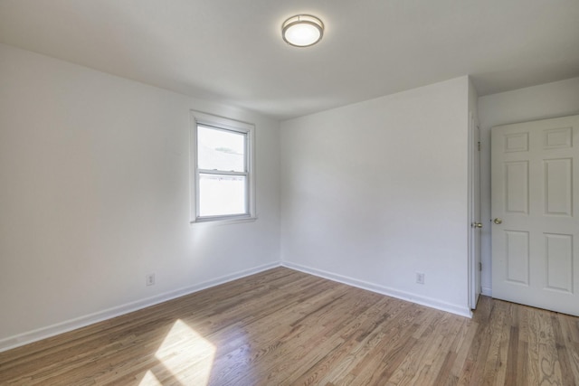 spare room featuring light hardwood / wood-style flooring