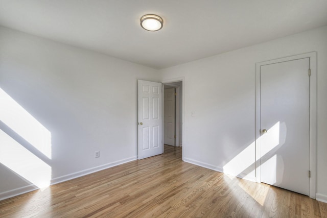 spare room featuring light wood-type flooring