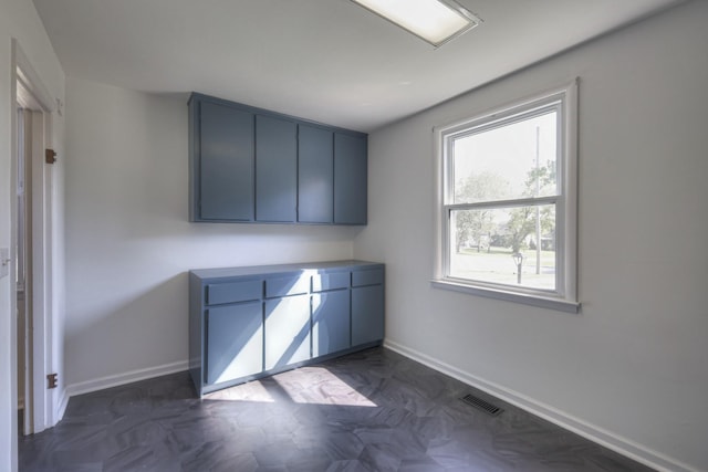 interior space featuring blue cabinets