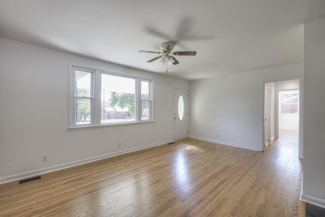 spare room featuring ceiling fan and light wood-type flooring