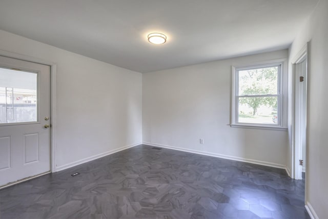 empty room with dark parquet floors