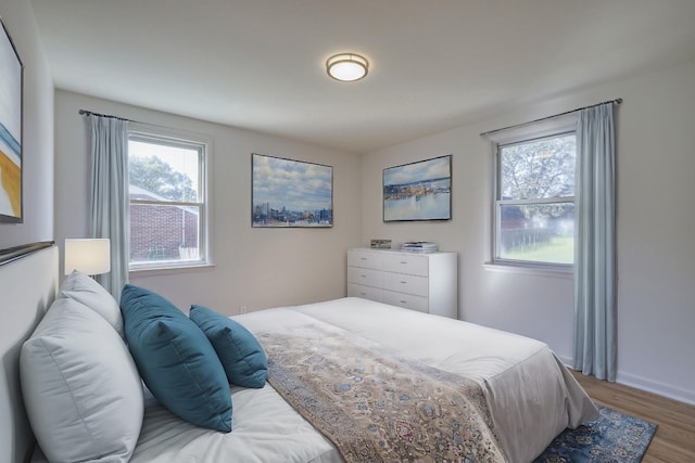 bedroom with hardwood / wood-style floors