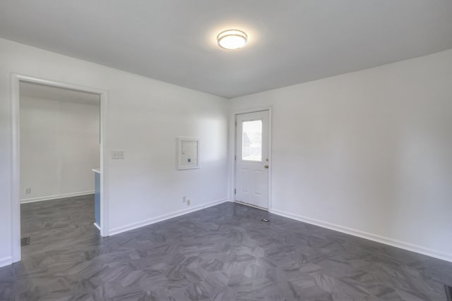 empty room featuring dark parquet flooring