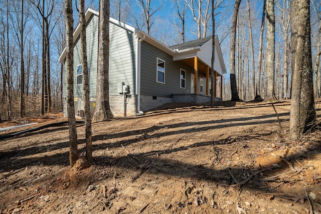 view of home's exterior with crawl space