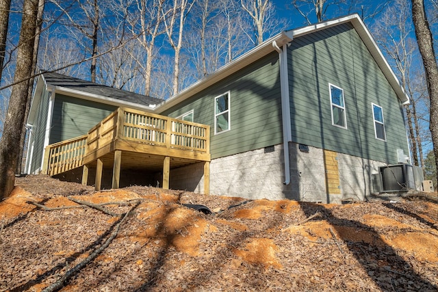 view of side of property featuring a deck