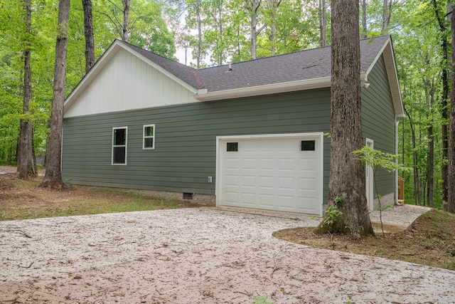 32 Periwinkle Ln, Leoma, TN 38468 - view of side of home with a garage, roof with shingles, and driveway