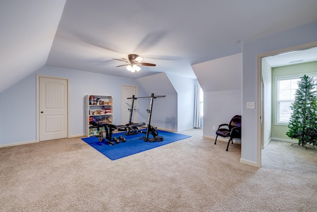 exercise area featuring carpet, vaulted ceiling, and ceiling fan