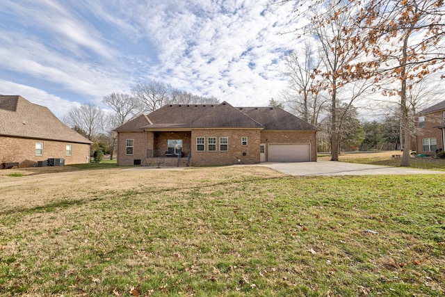 ranch-style house featuring central air condition unit, a front yard, and a garage