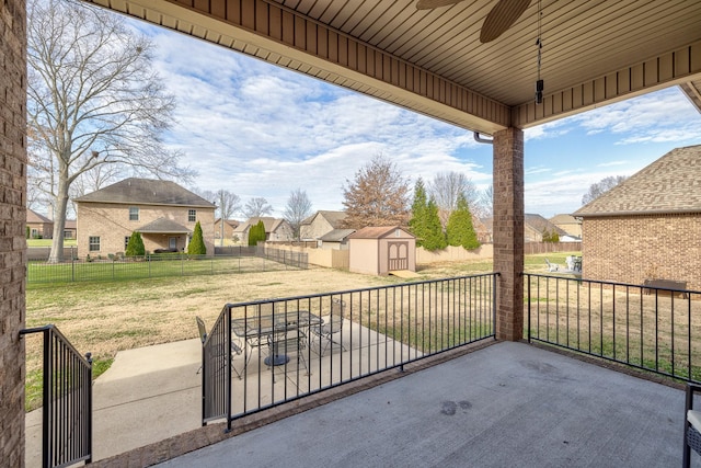 view of patio with a storage unit