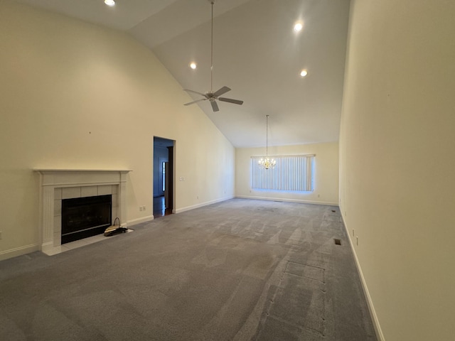 unfurnished living room with carpet flooring, a tiled fireplace, high vaulted ceiling, and ceiling fan with notable chandelier