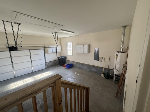 garage with electric panel and water heater